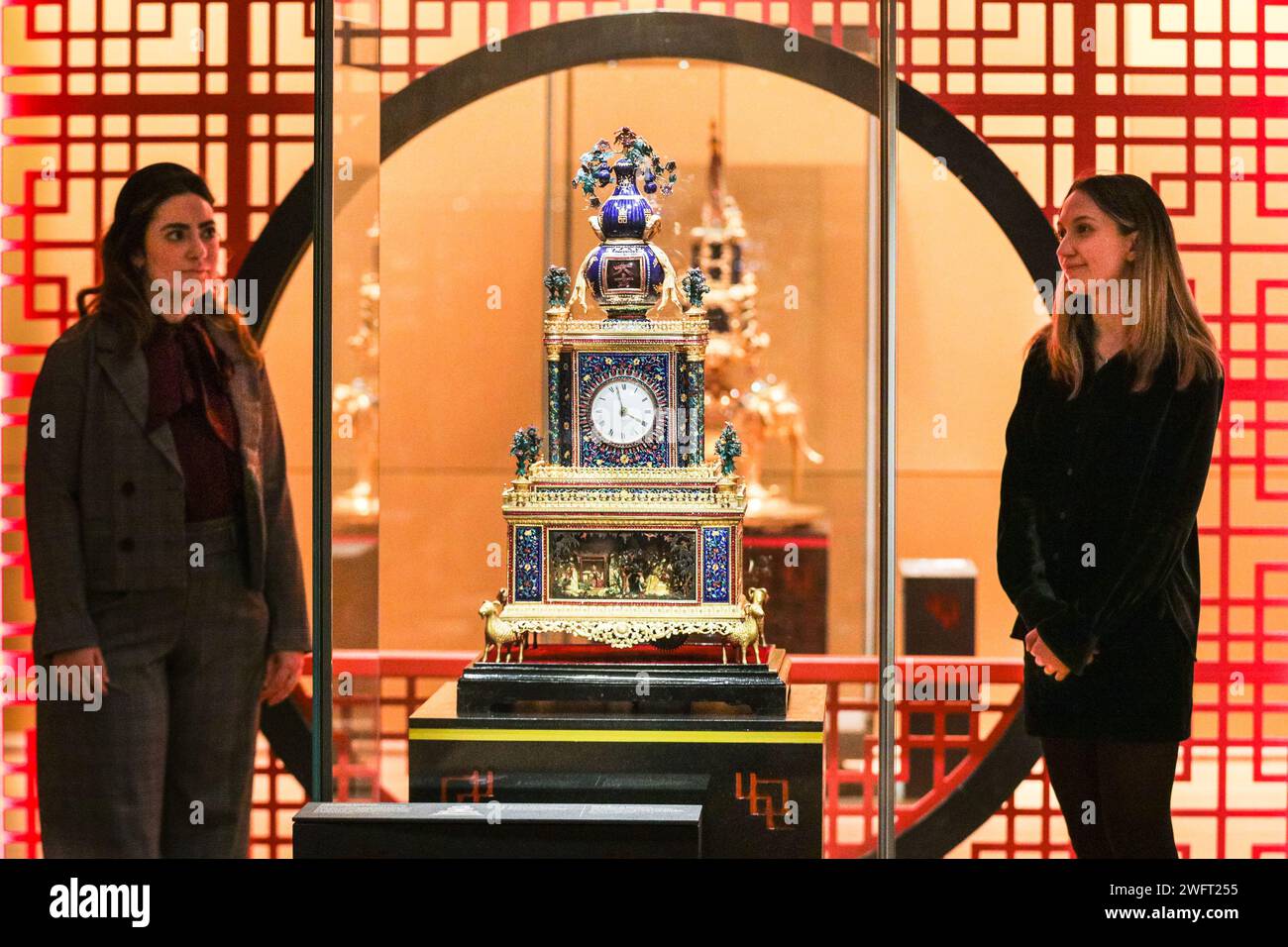 London, UK. 01st Feb, 2024. Museum staff pose with a beautiful Zimingzhong (Individual clocks are not titled, but carry descriptions). Zimingzhong: Clockwork Treasures from China's Forbidden City shows 23 ornate and rare Chinese clockwork automata known as zimingzhong, cherished for their intricate design and collected by Chinese emperors in the 1700s. Credit: Imageplotter/Alamy Live News Stock Photo