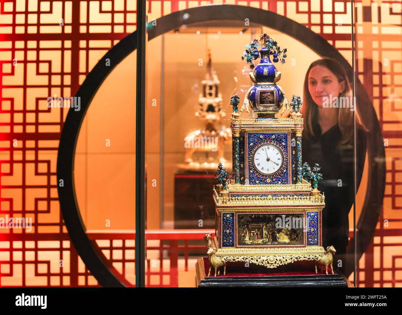 London, UK. 01st Feb, 2024. Museum staff pose with a beautiful Zimingzhong (Individual clocks are not titled, but carry descriptions). Zimingzhong: Clockwork Treasures from China's Forbidden City shows 23 ornate and rare Chinese clockwork automata known as zimingzhong, cherished for their intricate design and collected by Chinese emperors in the 1700s. Credit: Imageplotter/Alamy Live News Stock Photo