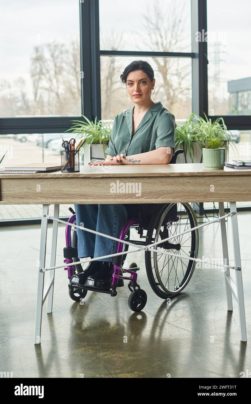 beautiful disabled businesswoman with tattoo sitting in wheelchair ...
