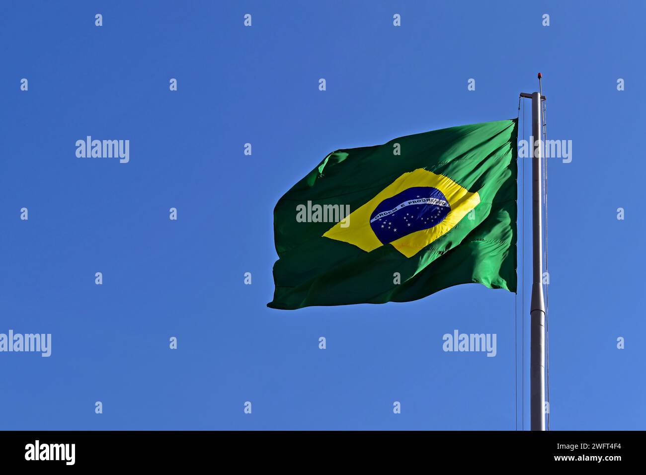 Brazilian flag and blue sky in Ribeirao Preto, Sao Paulo, Brazil Stock Photo