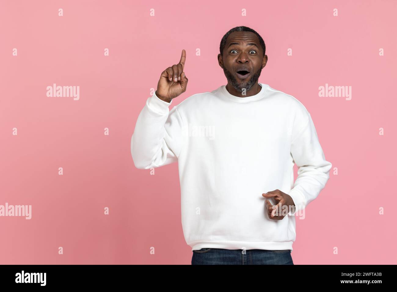 Excited black male pointing finger hi-res stock photography and images ...
