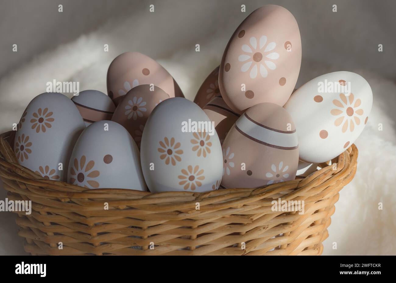 Painted easter eggs in a basket on a soft white background Stock Photo ...