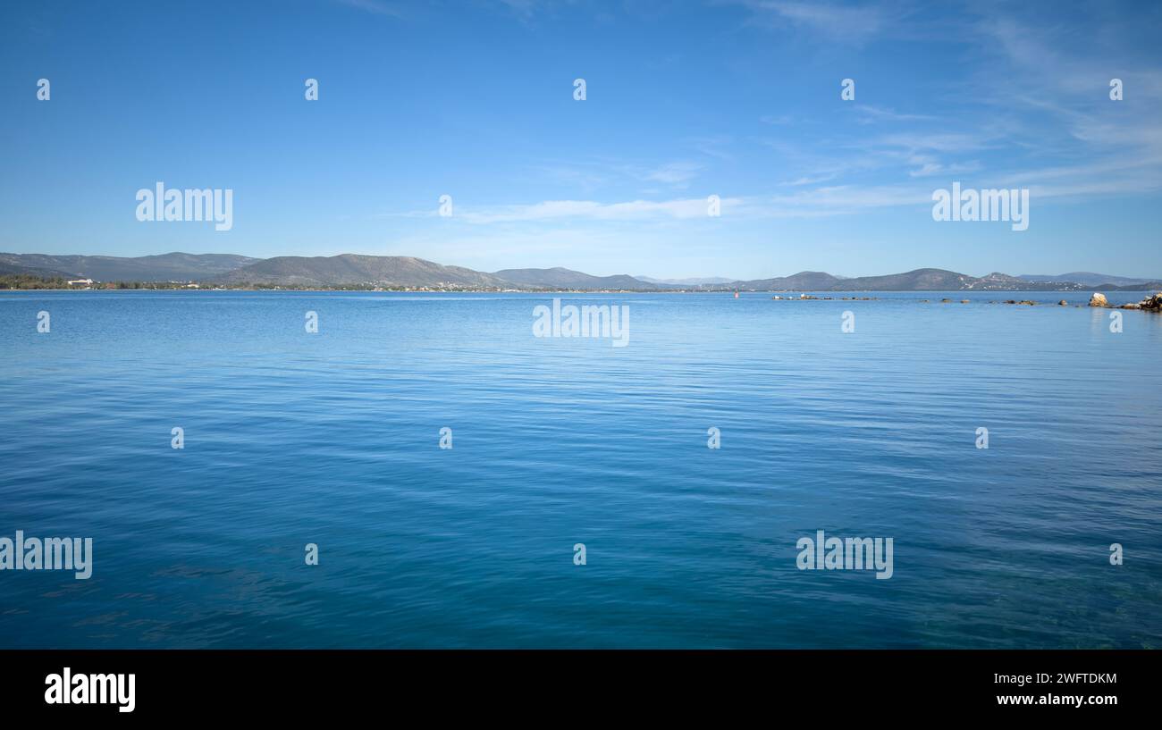 Nea Makri, Attica Greece. Panoramic view of vast Aegean calm sea background. Destination for vacation, tourism under Greek sun and blue sky. Stock Photo