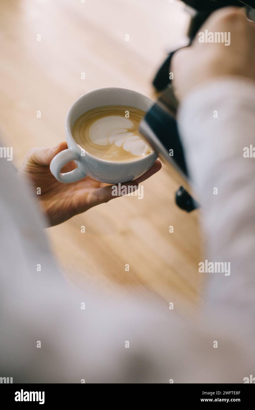 Close-up, barista preparing latte. Stock Photo
