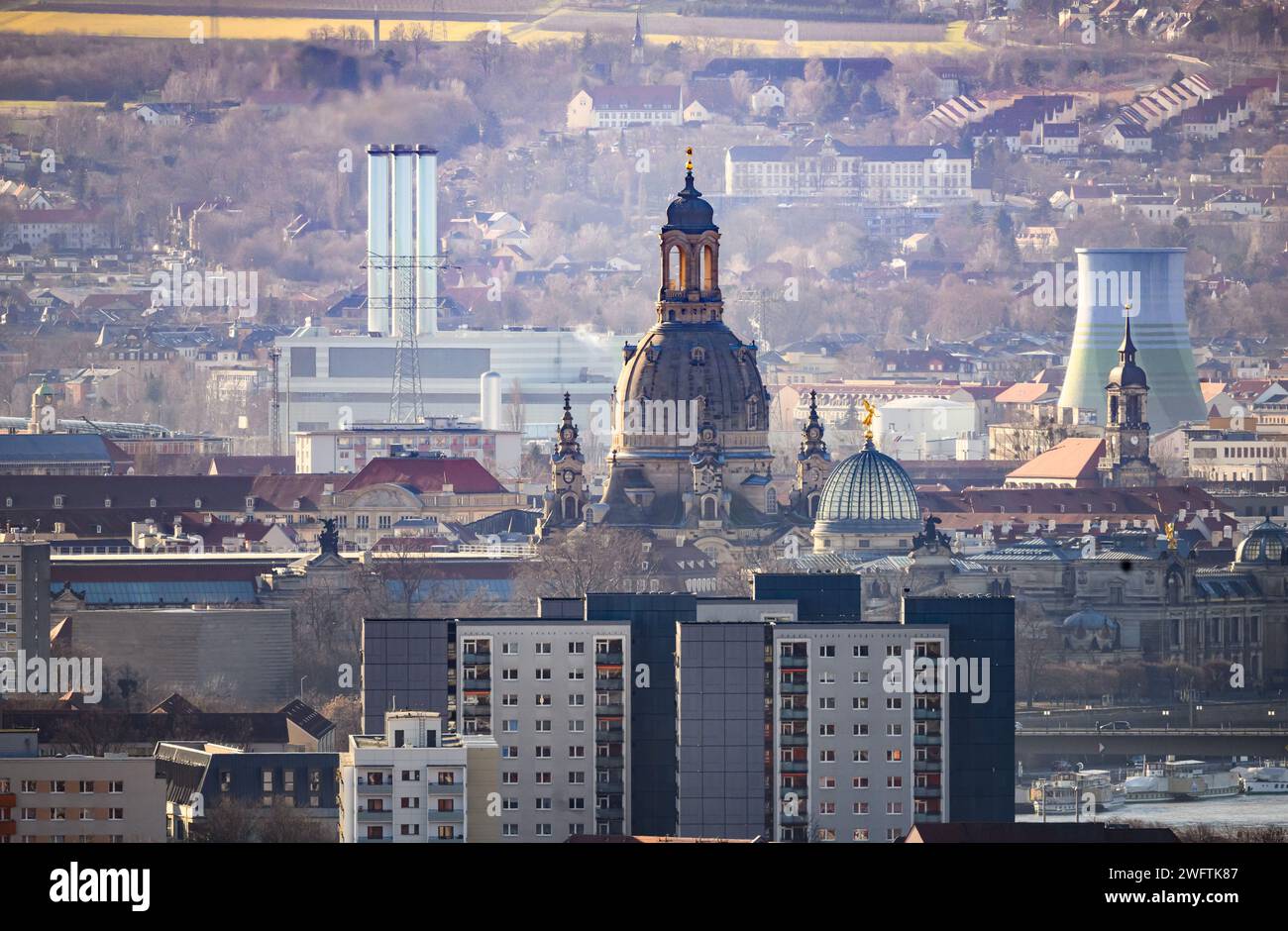 Dresden, Germany. 01st Feb, 2024. View of the Frauenkirche church in the old town behind the high-rise buildings of Johannstadt, with the Nossener Brücke gas turbine cogeneration plant in the Löbtau-Nord district behind it. Credit: Robert Michael/dpa/Alamy Live News Stock Photo