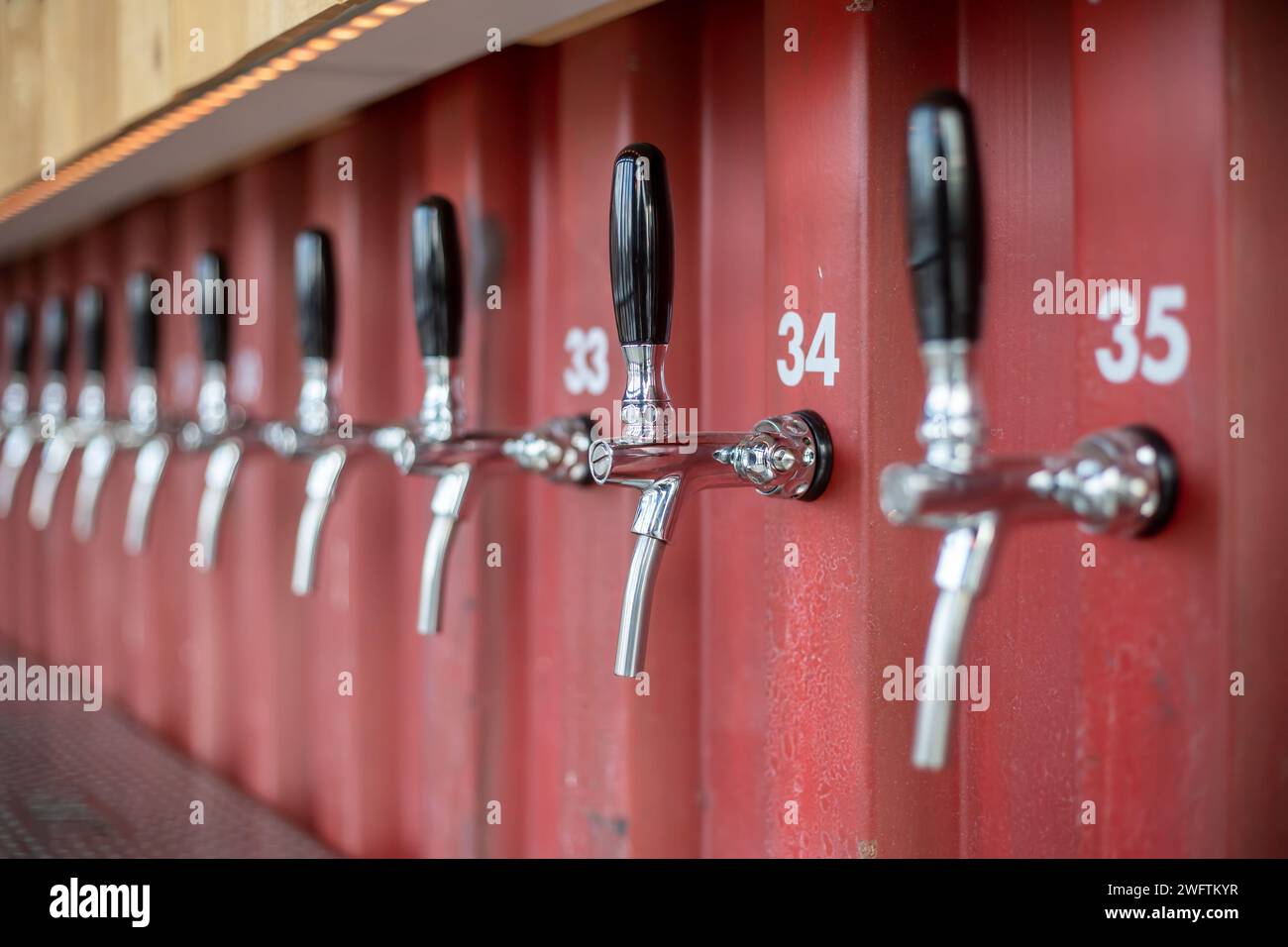 many draft beer handles in a row Stock Photo Alamy