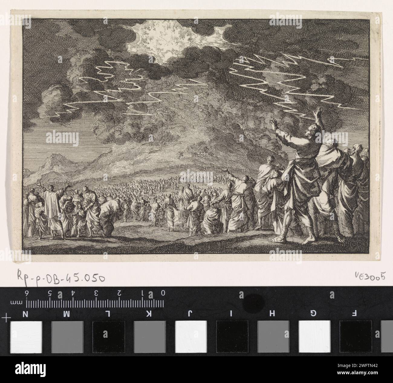 Moses on Mount Sinai, Jan Luyken, 1703 print  Print Maker: Haarlem Publisher: Amsterdam paper etching Mount Sinai is covered by a thick cloud, thunder and lightning Stock Photo