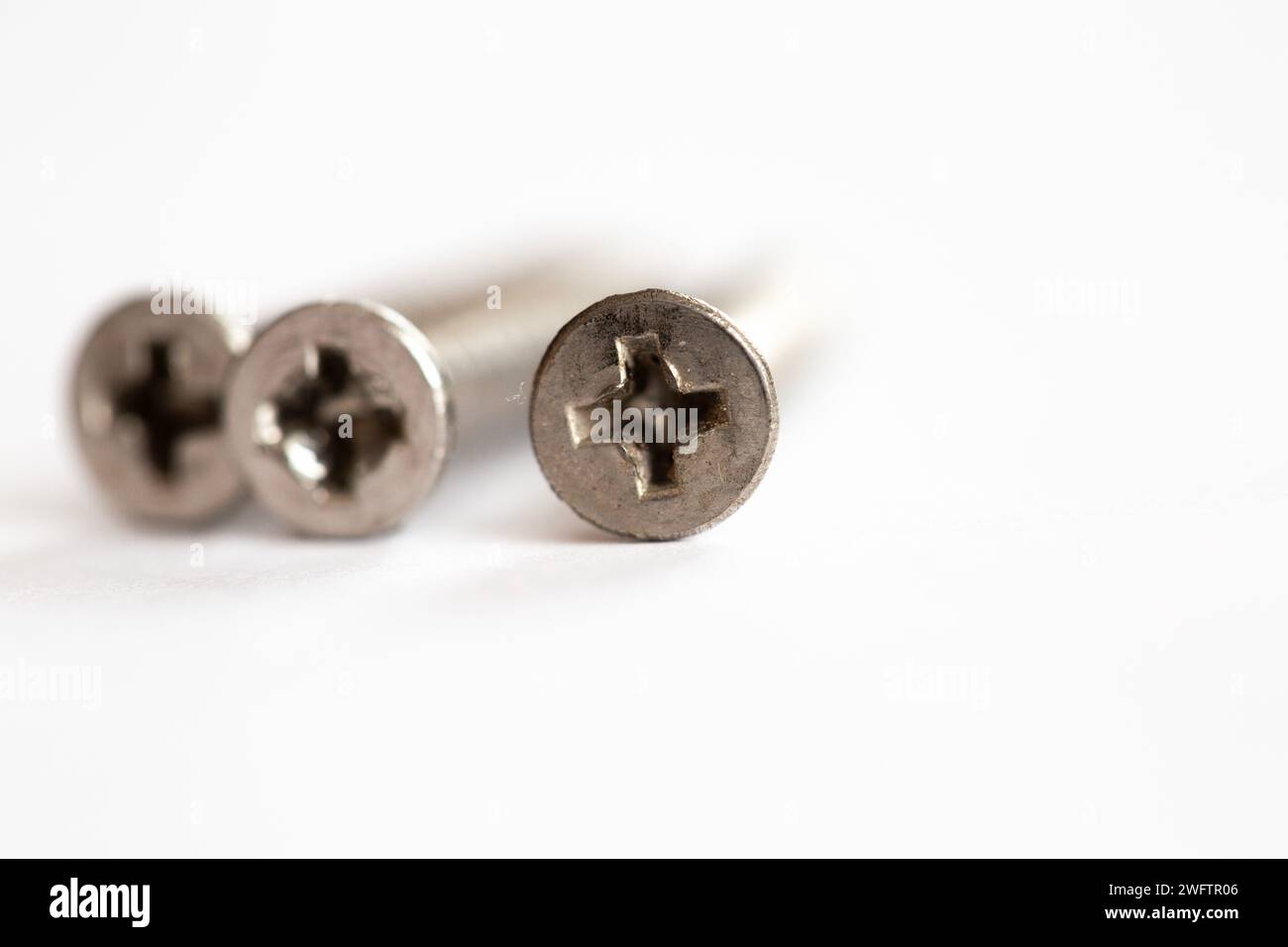 Star head screws laying on their side on a white background Stock Photo