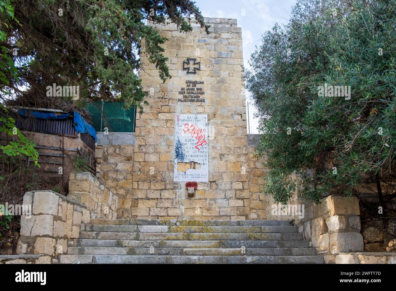 Controversial damaged Nazi-era memorial to the German paratroopers who invaded Crete in the Second World War, Chania Stock Photo