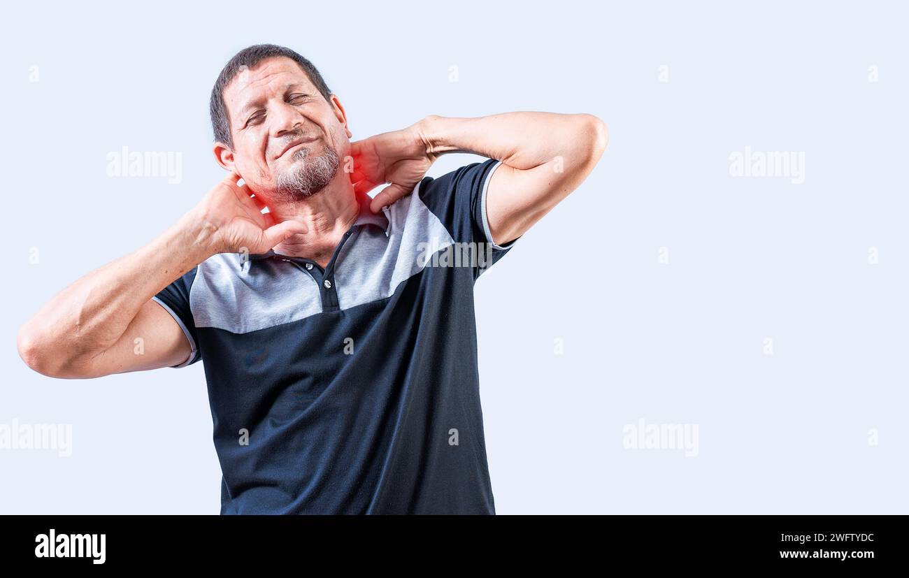 Neck pain and stress concept. Elderly person suffering with neck pain isolated. Mature man with neck tension isolated Stock Photo