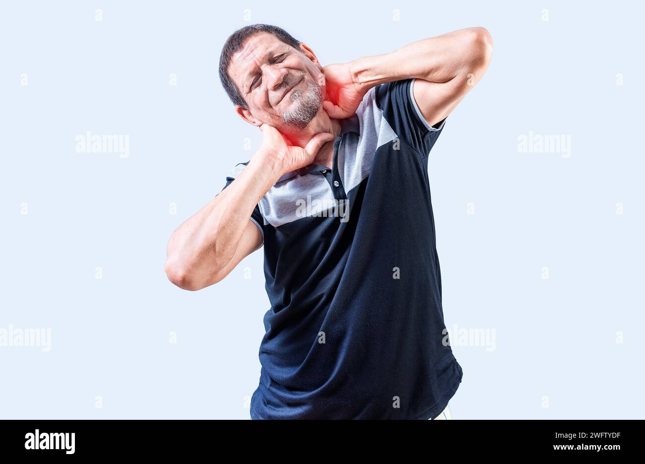 Elderly person suffering with neck pain isolated. Mature man with neck tension isolated. Neck pain and stress concept Stock Photo