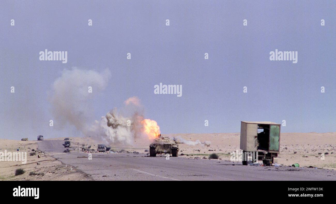 5th March 1991 An abandoned Iraqi T55 tank spews smoke and flame as it burns on Route 801, the road to Um Qasr, north of Kuwait City. Stock Photo