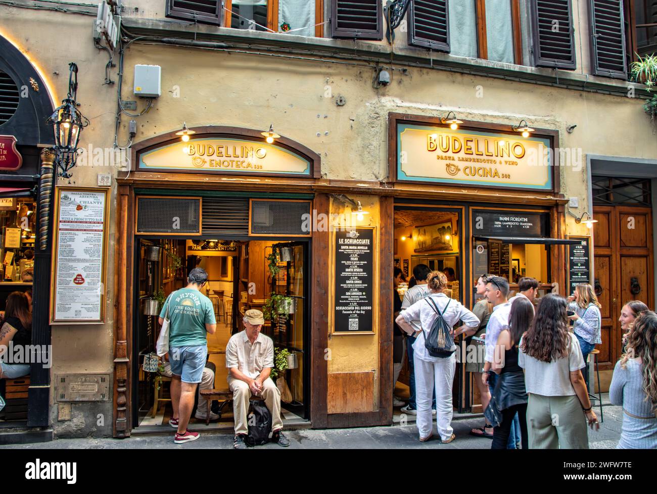 People queuing outside Budellino a sandwich shop and restaurant  on Via dei Neri ,Florence, Italy Stock Photo