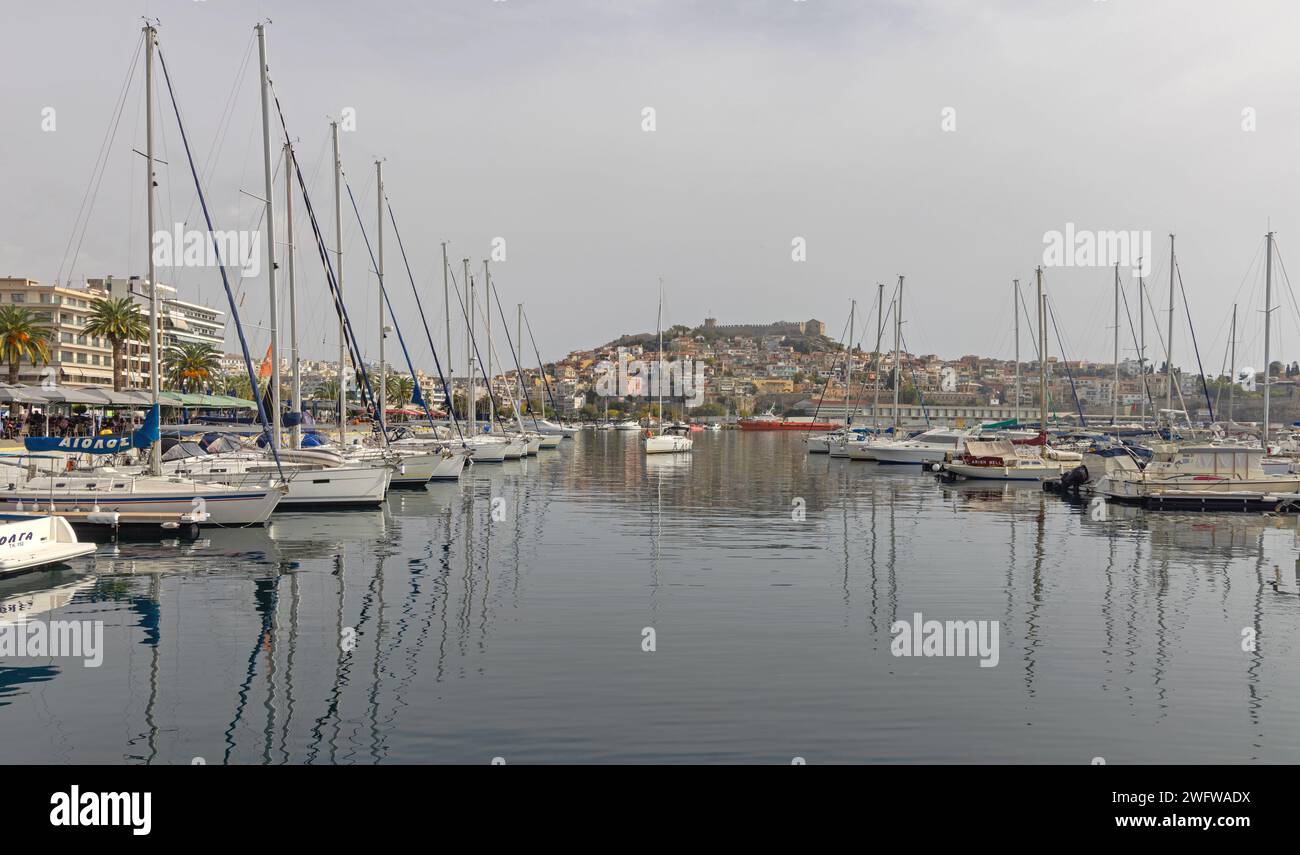 Kavala, Greece - October 22, 2023: Sailboats and Motor Yachts Moored at Port of Kavala at Calm Autumn Day. Stock Photo