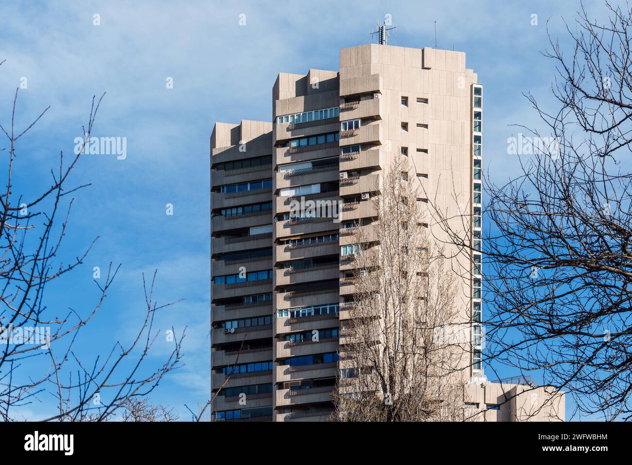 Madrid, Spain - January 28, 2024: Luxury residential tower. Tower of Valencia near Retiro Park. Brutalist architecture by Javier Carvajal architect Stock Photo