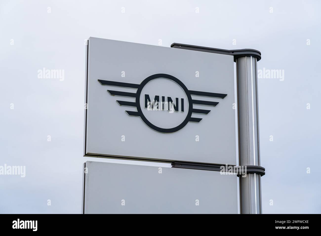 Wolverhampton, England – January 31 2024: Logo of the car brand Mini outside a dealership in Wolverhampton Stock Photo