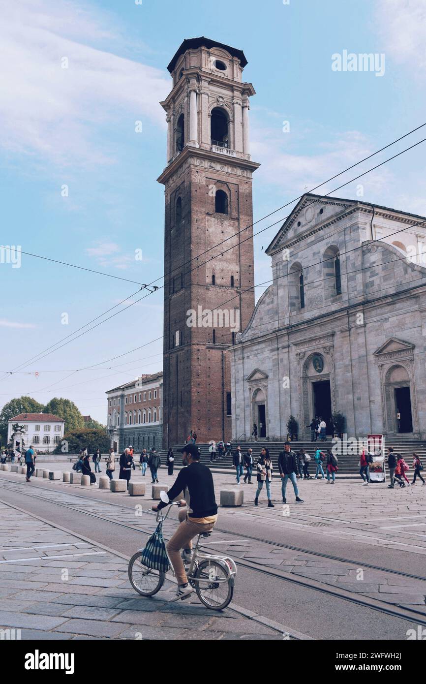 Bicycle man walking through the historic center of Turin in Italy on May 10, 2022 Stock Photo
