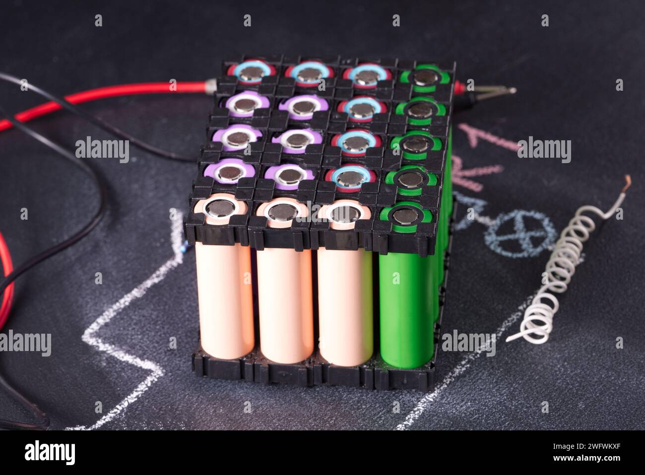 Lithium battery pack in black plastic holder dark background. Stock Photo