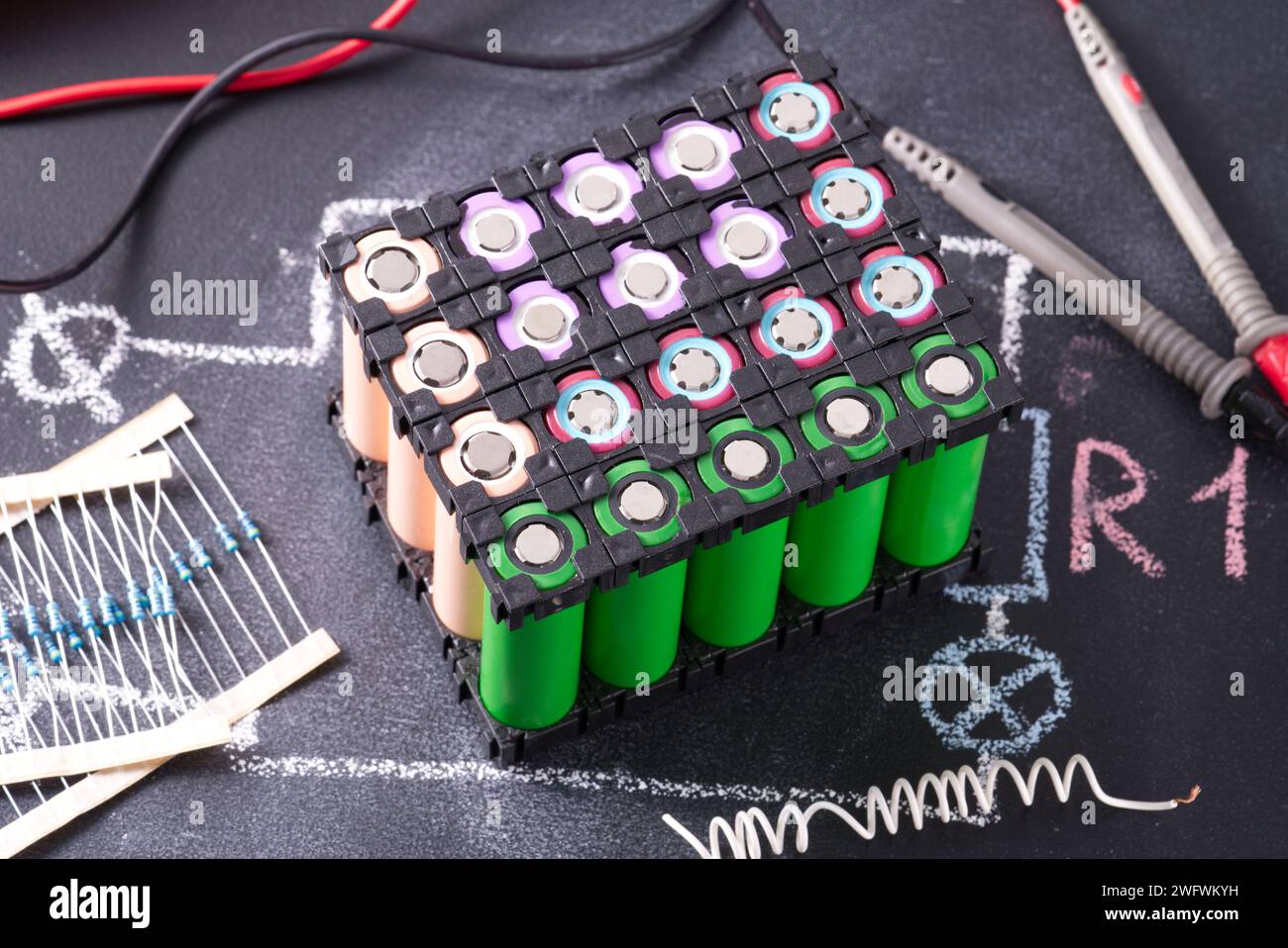 Lithium battery pack in black plastic holder dark background. Stock Photo