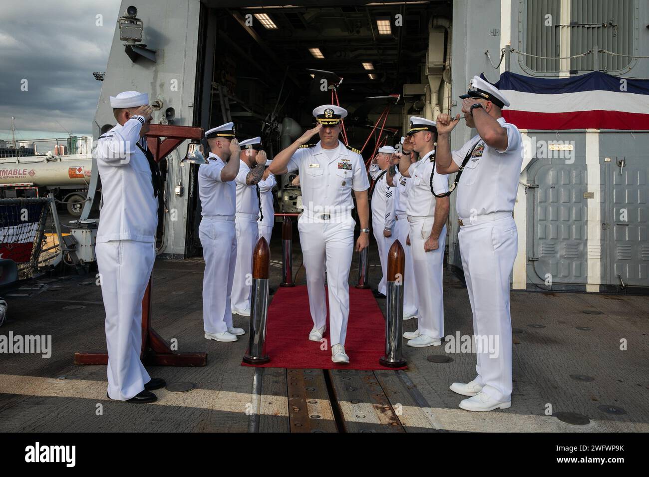 240108-N-VM650-1073 MANILA, PHILIPPINES (Jan. 8, 2024) Capt. Craig Trent is piped aboard during a change of command ceremony aboard Arleigh Burke-class guided-missile destroyer USS Sterett (DDG 104). During the ceremony, Trent relieved Capt. Thomas Chekouras as Commodore, Destroyer Squadron ONE. USS Sterett is in the Philippines for a scheduled port visit, supporting operational readiness and regional partnerships. Sterett is assigned to Carrier Strike Group 1 and deployed to the U.S. 7th Fleet area of operations in support of a free and open Indo-Pacific. Stock Photo