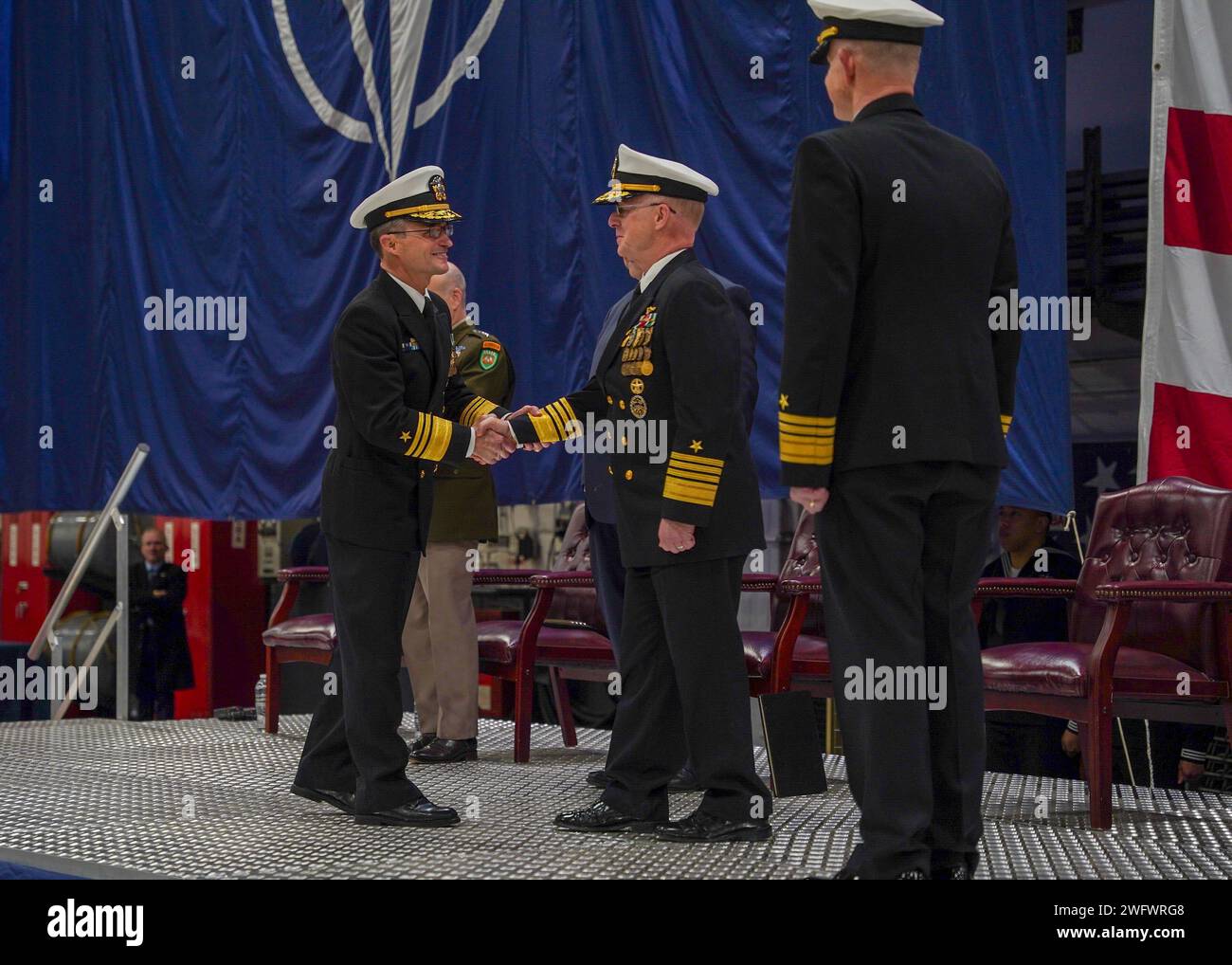 Vice adm doug perry shakes hands with commander u s fleet forces