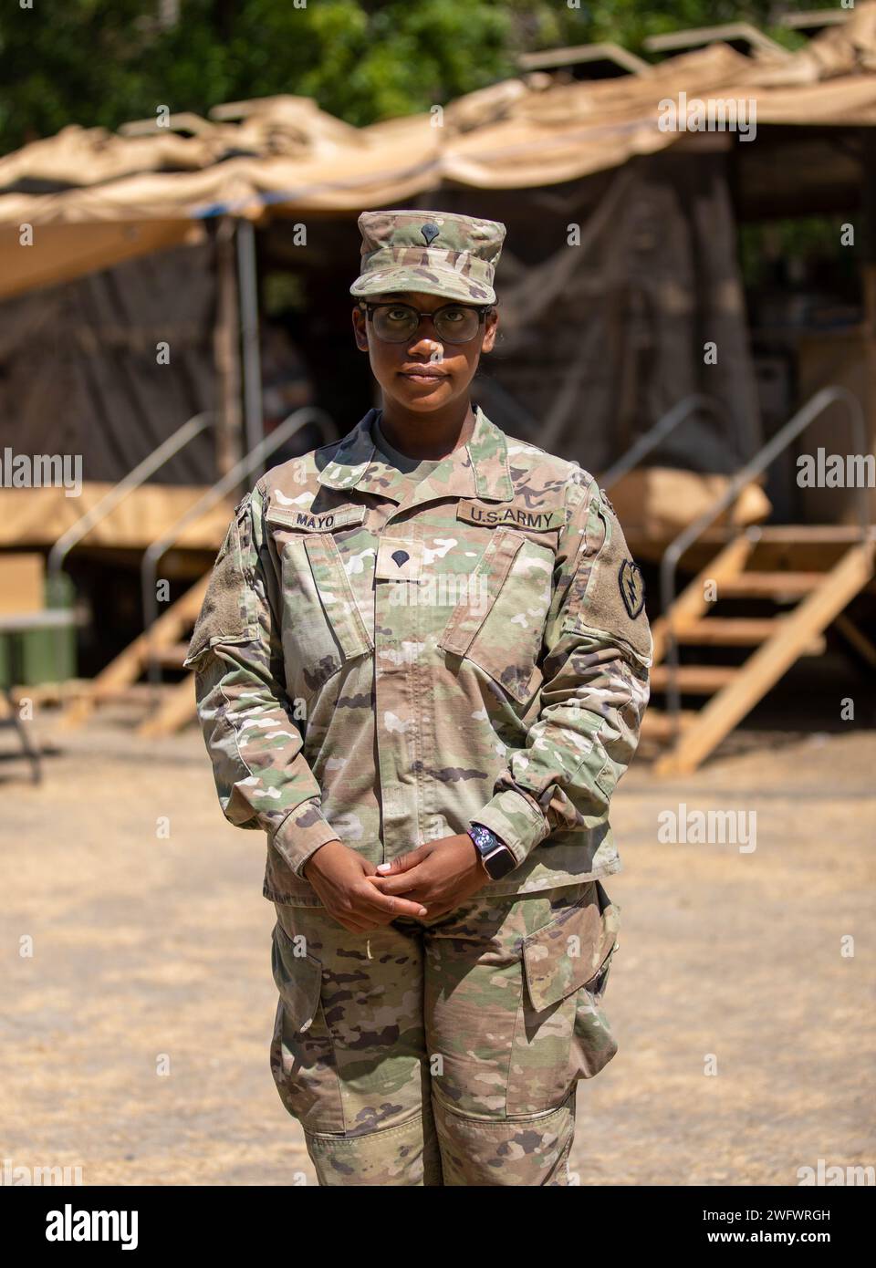 U.S. Army Spc. Gladys Mayo, a Culinary Specialist, assigned to 25th Division Sustainment Brigade, 25th Infantry Division, poses for a photo for Exercise Super Garuda Shield 2023, at the 5th Marine Training Center (Puslatpur), Situbondo Regency, East Java, Indonesia, on September 2, 2023.  SuperGarudaShield 2023 is an annual exercise that has significantly grown in scope and size since 2009. SGS2023 is the second consecutive time this exercise has grown into a combined and joint event, highlighting the 7 participating and 12 observing nations' commitment to #partnership and a free and open Indo Stock Photo