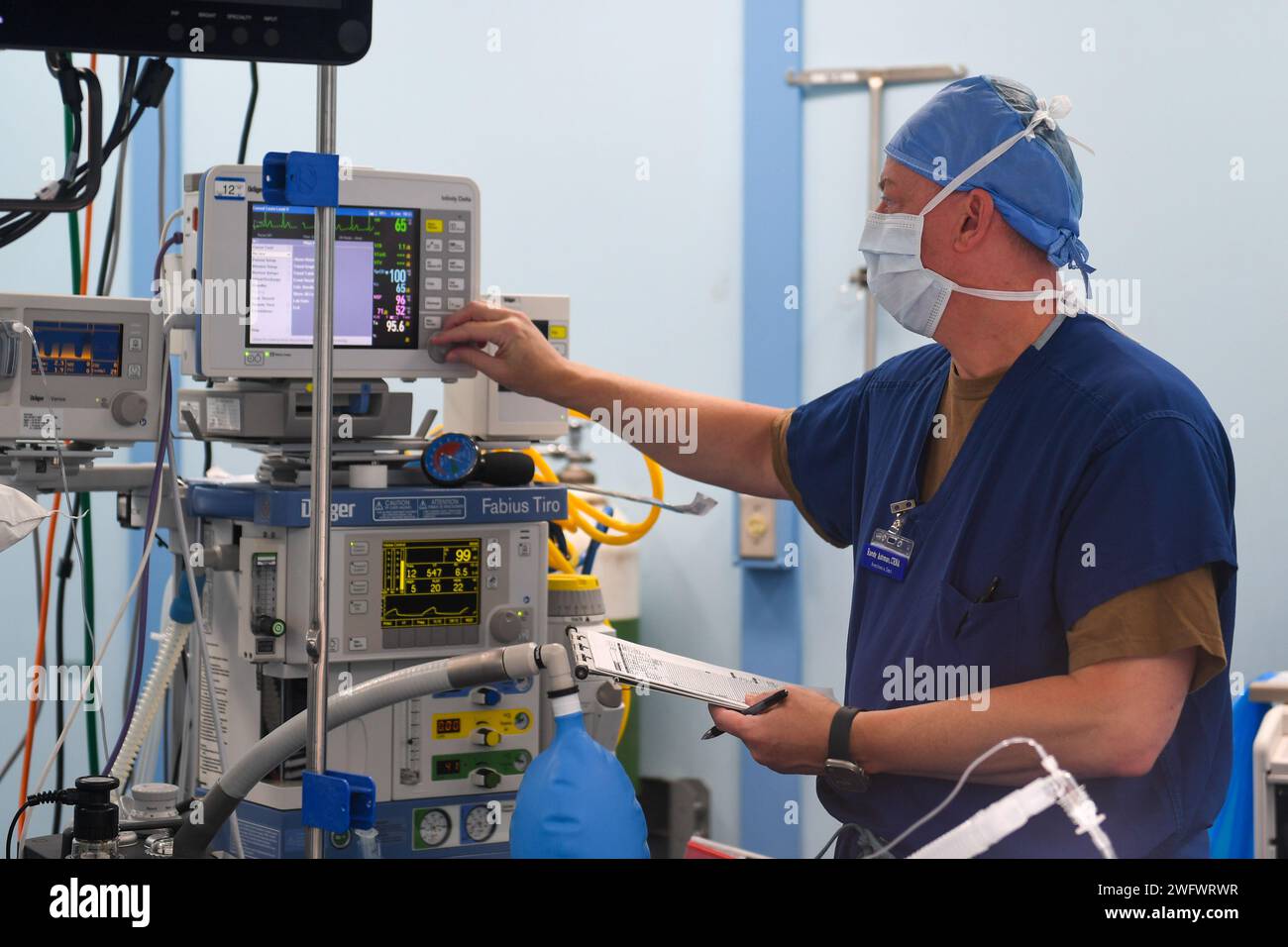 U.S. Navy Capt. Randy Ashman from Portland, Oregan, performs surgery on a local patient aboard the hospital ship USNS Mercy (T-AH 19), anchored off of Koror, Palau, as part of Pacific Partnership 2024-1, Jan. 3, 2024. Pacific Partnership, now in its 19th iteration, is the largest multinational humanitarian assistance and disaster relief preparedness mission conducted in the Indo-Pacific and works to enhance regional interoperability and disaster response capabilities, increase security stability in the region, and foster new and enduring friendships. Stock Photo