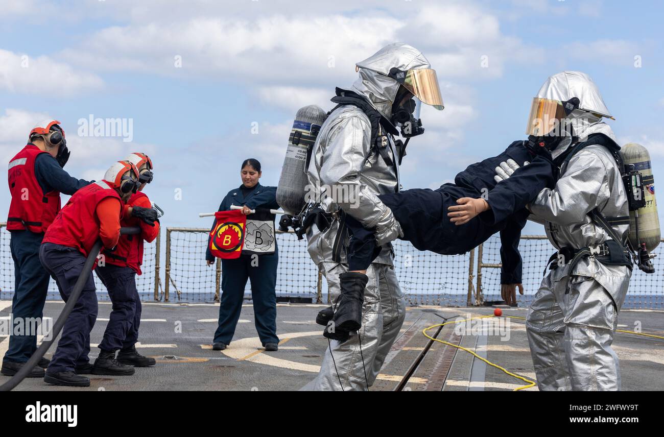 YOKOSUKA, Japan (Jan. 29, 2024) Sailors simulate fighting a fire and ...