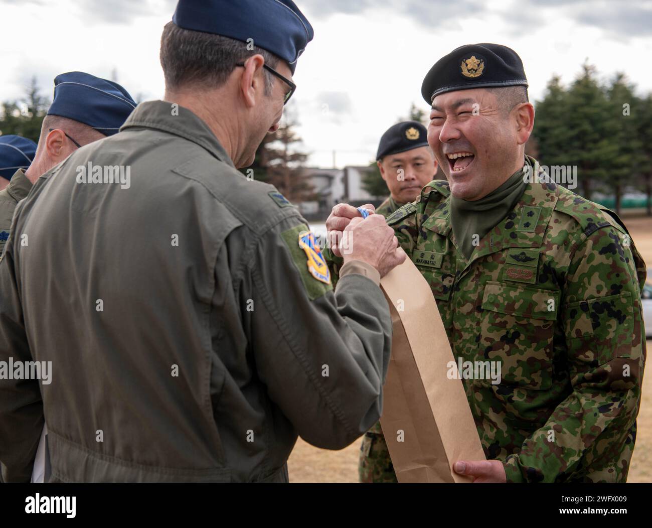 U.S. Air Force Col. Andrew Roddan, left, 374th Airlift Wing commander ...