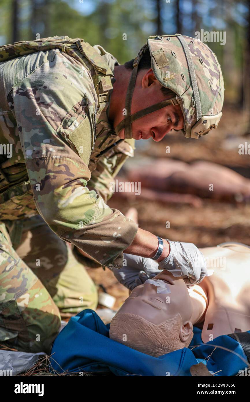 U.S. Army Spc. Cesar Guzman, a combat medic assigned to 407th Brigade ...