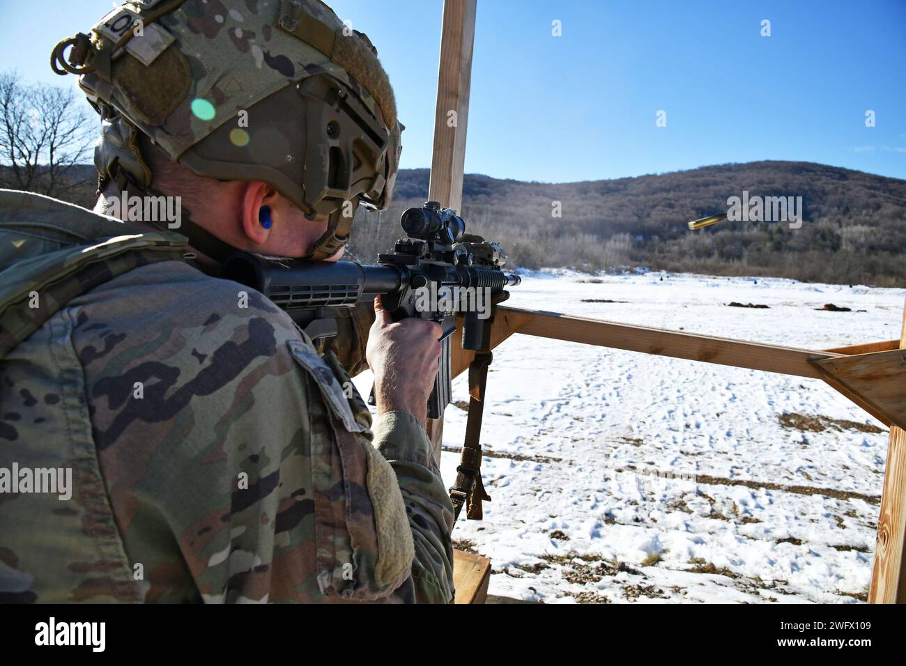 A U. S. Army paratrooper assigned to the 54th Brigade Engineer Battalion, 173rd Airborne Brigade, engages targets with the M4 Carbine during a live-fire exercise as part of Castle Dvorac 24 in Slunj, Croatia, Jan. 23, 2024. The 173rd Airborne Brigade is the U.S. Army's Contingency Response Force in Europe, providing rapidly deployable forces to the United States European, African, and Central Command areas of responsibility. Forward deployed across Italy and Germany, the brigade routinely trains alongside NATO allies and partners to build partnerships and strengthen the alliance. Stock Photo