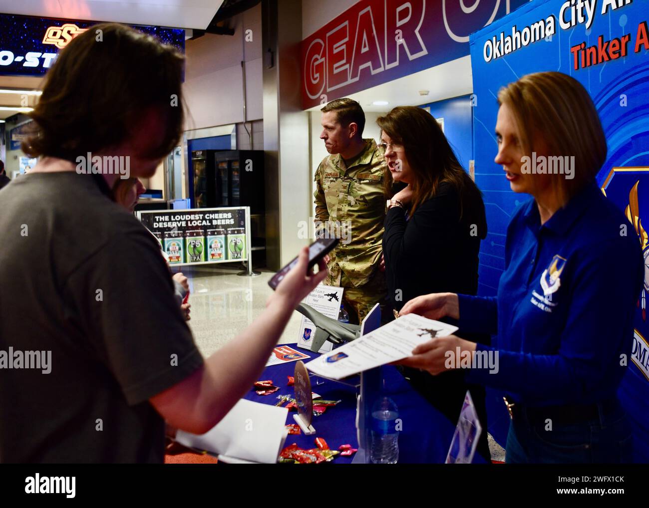OKLAHOMA CITY —Abbey Charlow, right, and Tina Murphy, Oklahoma City Air Logistics Complex community engagement & outreach team, and Col Jeffrey Anderson, middle, deputy commander of the OC-ALC, speak to high school students at the OC-ALC informational booth during the OKC Thunder’s Aero-Student Day at the Paycom Center Jan. 23. More than 450 high school students attended the event to learn more about careers in the aerospace industry. Stock Photo