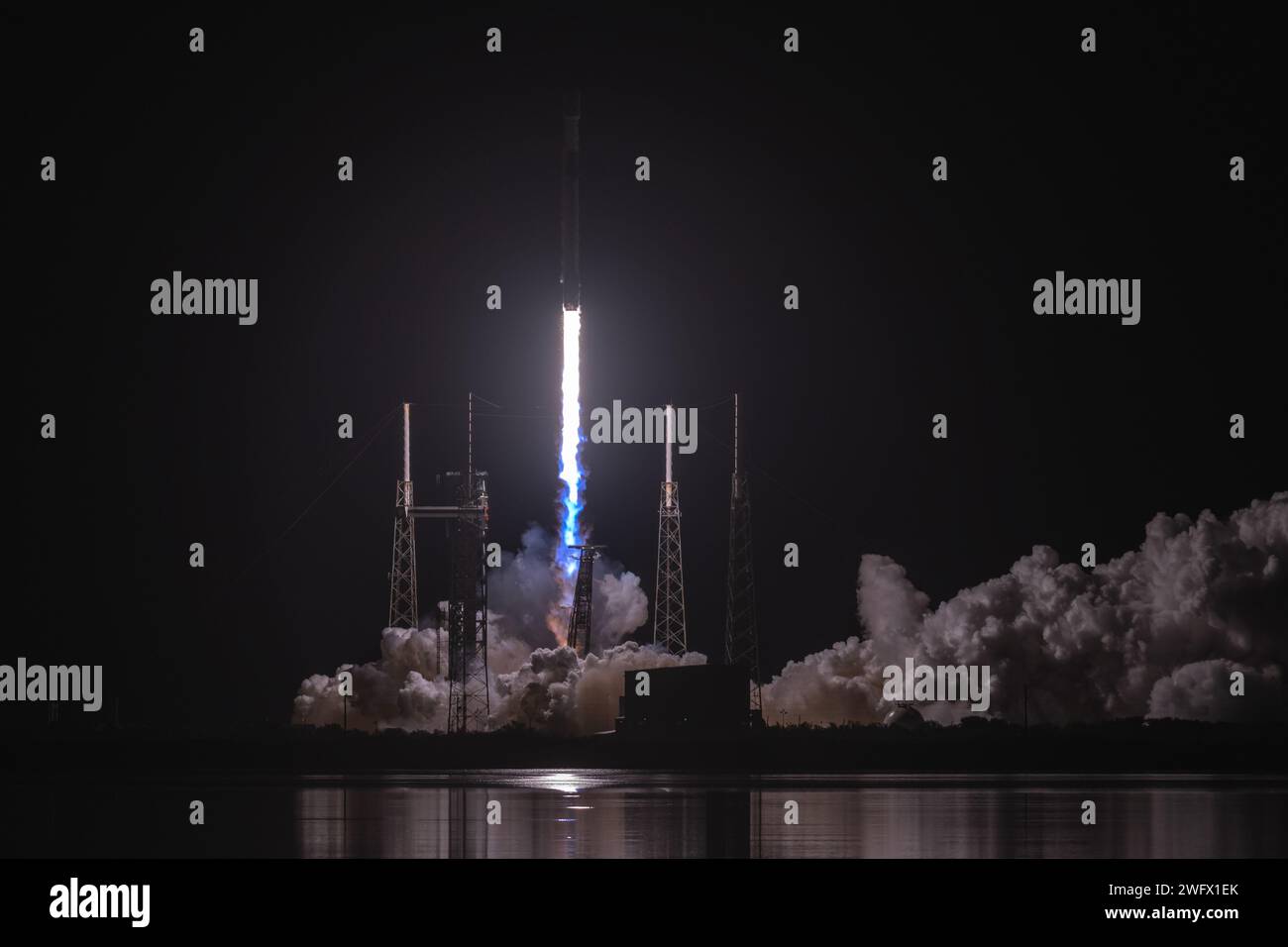 A Falcon 9 rocket carrying 23 Starlink satellites launches from Space Launch Complex 40 (SLC-40) at Cape Canaveral Space Force Station, Florida, Jan. 14, 2024. This was the 12th flight for the first stage booster supporting this mission, which previously launched SES-22, iSpace’s HAKUTO-R Mission 1, Hispasat Amazonas Nexus, CRS-27, and now eight Starlink missions. Stock Photo