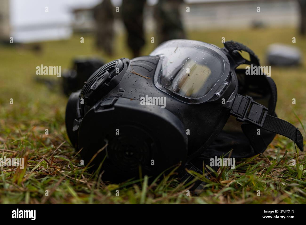 An M50 gas mask is staged on the floor after U.S. Marines across III Marine Expeditionary Force (MEF) participated in a chemical biological radiological nuclear defense training event hosted by III MEF at Marine Corps Air Station Futenma, Okinawa, Japan, Jan. 23, 2023. III MEF conducted this event to develop skills in sensitive site exploitation and to sustain investigative capabilities. Stock Photo
