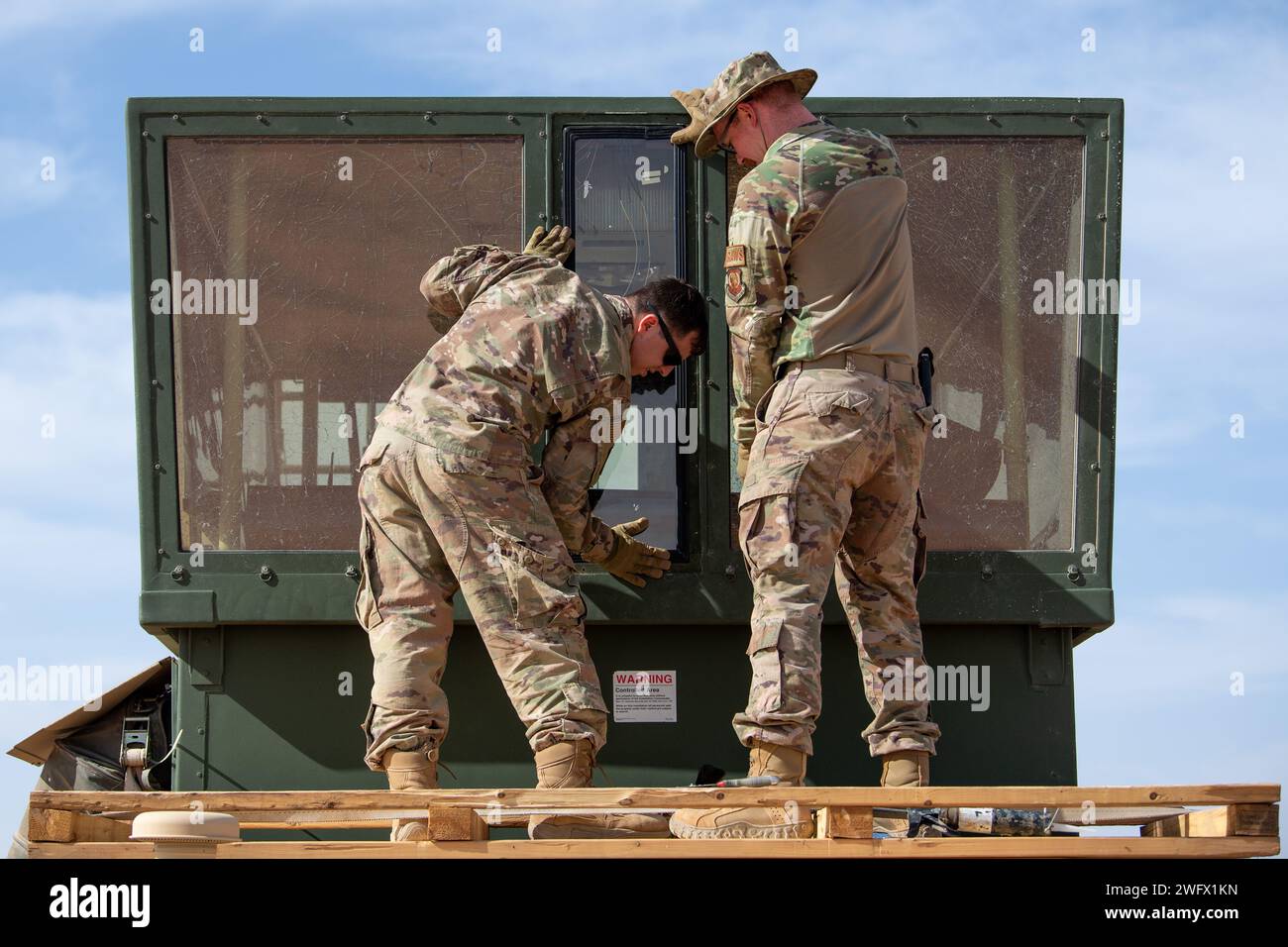 U.S. Air Force Senior Airman Conor Mills, left, and Staff Sgt. Eric