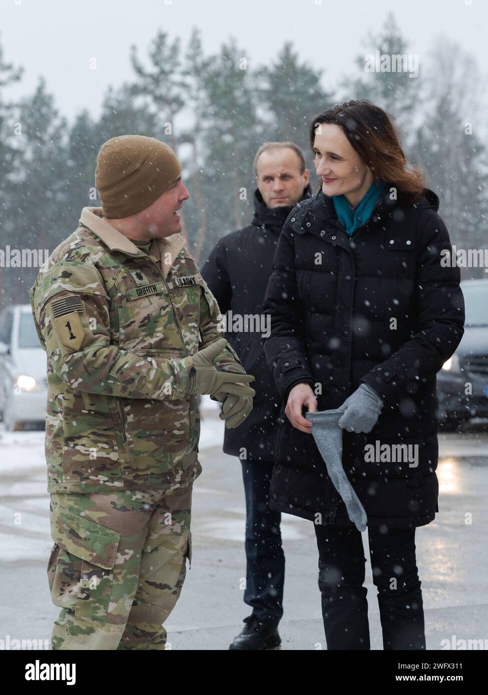 U.S. Army Lt. Col. David Griffith, the commander of 3rd Battalion, 67th Armored Regiment, 2nd Armored Brigade Combat Team, 3rd Infantry Division, welcomes Lithuanian Speaker of Parliament Viktorija Čmilytė-Nielsen during a tour of Camp Herkus, Lithuania, Jan. 4. 2024. The 3rd Infantry Division’s mission in Europe is to engage in multinational training and exercises across the continent, working alongside NATO Allies and regional security partners to provide combat-credible forces to V Corps, America’s forward deployed corps in Europe. Stock Photo