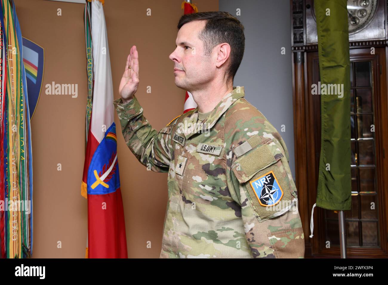 U.S. Army Col. John B. Mountford is promoted to Brig. Gen. by U.S. Army Europe & Africa Commanding General, Gen. Darryl A. Williams along with Brig. Gen. Mountford’s wife during his promotion ceremony at Clay Kaserne, Wiesbaden, Germany, Jan. 19, 2024. Brig. Gen. Mountford serves as the Deputy Chief of Staff of Operations at Allied Rapid Reaction Corps (ARRC) in United Kingdom. The ARRC is a rapid reaction force maintained by NATO and is capable of deploying a High Readiness Force Headquarters at short notice for operations and crisis response. Stock Photo