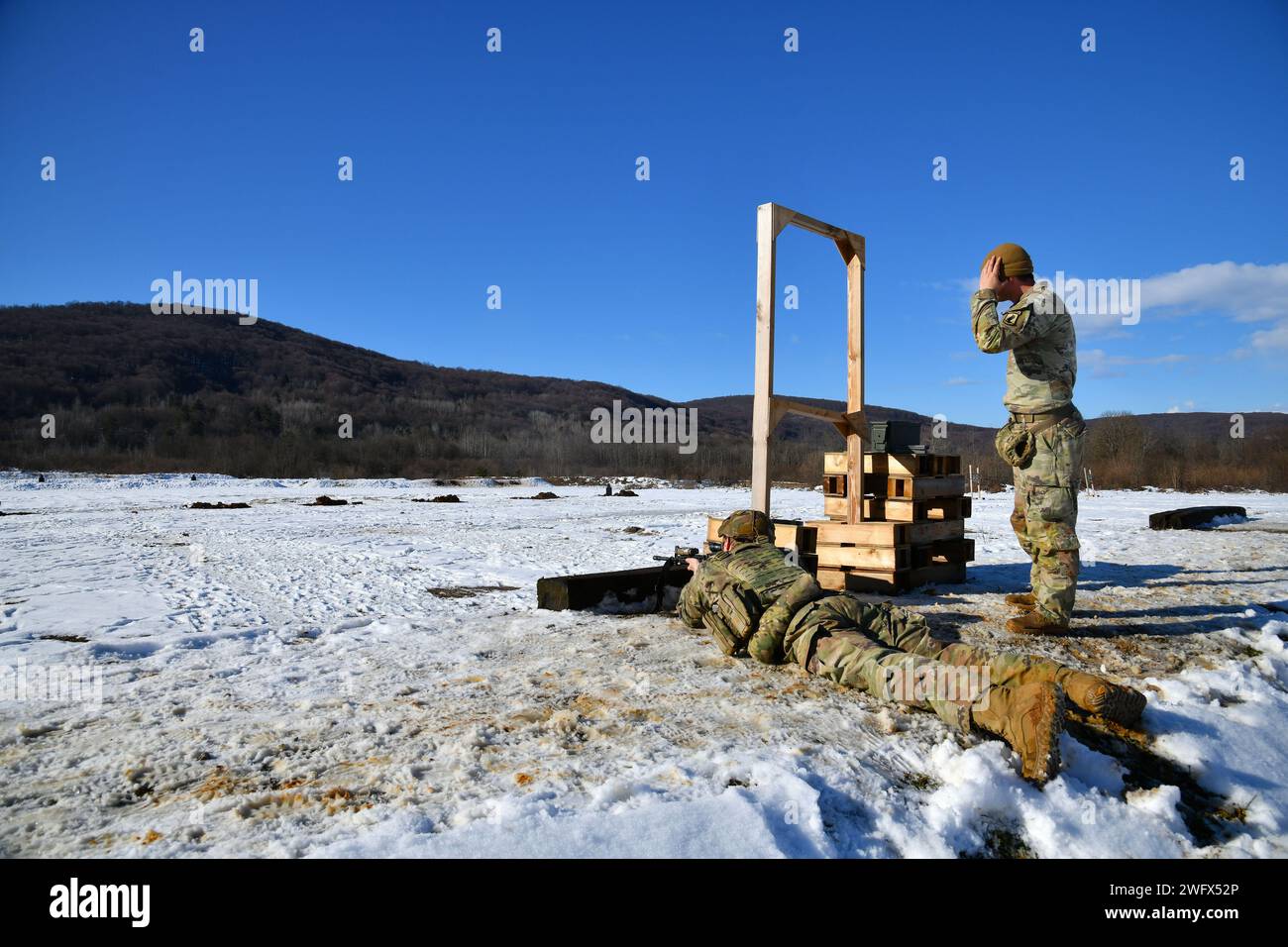 A U. S. Army paratrooper assigned to the 54th Brigade Engineer Battalion, 173rd Airborne Brigade, engages targets with the M4 Carbine during a live-fire exercise as part of Castle Dvorac 24 in Slunj, Croatia, Jan. 23, 2024. The 173rd Airborne Brigade is the U.S. Army's Contingency Response Force in Europe, providing rapidly deployable forces to the United States European, African, and Central Command areas of responsibility. Forward deployed across Italy and Germany, the brigade routinely trains alongside NATO allies and partners to build partnerships and strengthen the alliance. Stock Photo