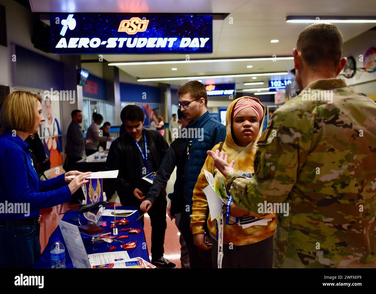 OKLAHOMA CITY —Col Jeffrey Anderson, right, deputy commander of the Oklahoma City Air Logistics Complex, and Abbey Charlow, left, a member of the OC-ALC community engagement & outreach team, engage with high school students at the OC-ALC informational booth during the OKC Thunder’s Aero-Student Day at the Paycom Center Jan. 23. More than 450 high school students attended the event to learn more about careers in the aerospace industry. Stock Photo