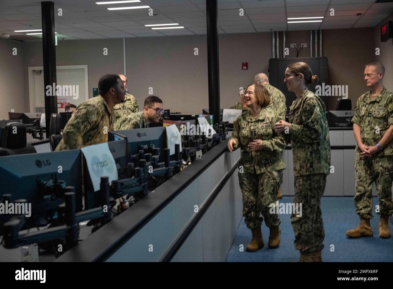 NAPLES, Italy (Jan. 22, 2024) - Chief of Naval Operations Adm. Lisa Franchetti and Master Chief Petty Officer of the Navy James Honea meet with Sailors during a tour of the Maritime Operations Center (MOC) at the U.S. Naval Forces Europe-Africa Headquarters in Naples, Italy, Jan. 22. Franchetti and Honea traveled to Italy to meet with Sailors and communicate the CNO’s strategic priorities of warfighting, warfighters and the foundation that supports them with the fleet. Stock Photo