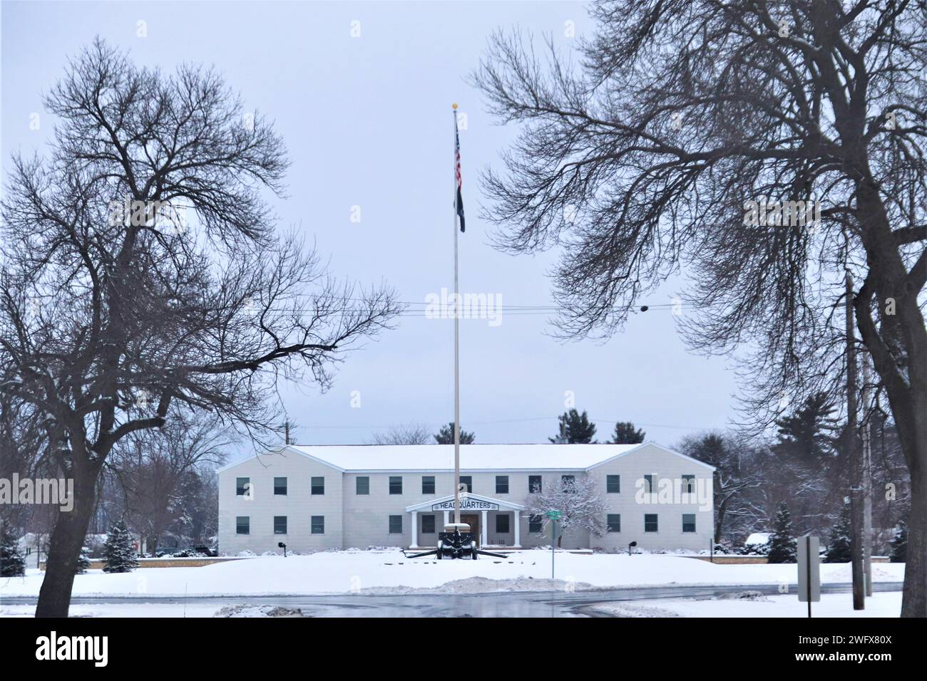 The installation’s flagpole and garrison headquarters area is shown covered in snow Jan. 10