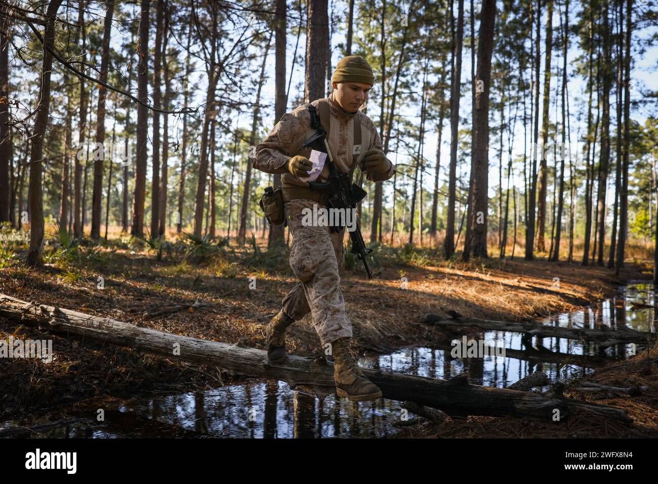 Recruits with India Company, 3rd Recruit Training Battalion, conduct the land navigation course on Marine Corps Recruit Depot Parris Island, S.C., Jan. 17, 2024. Land navigation is part of Basic Warrior Training and is designed to teach recruits how to use a lensatic compass and topographic map. Stock Photo