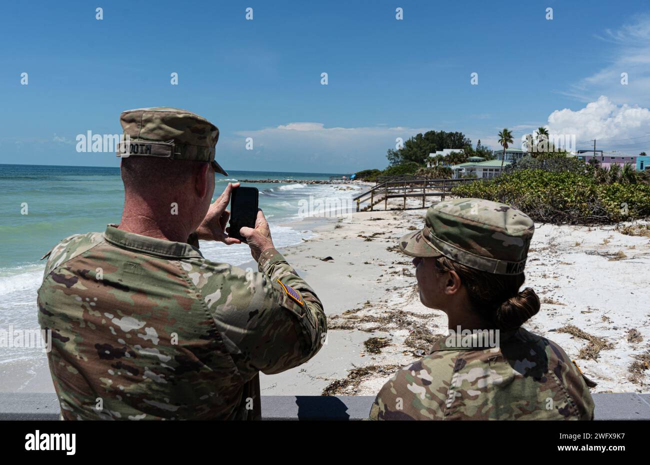 Sunset Beach, Fl. September 1, 2023, U.S. Army Corps of Engineers, Jacksonville District Commander, Col. James Booth, and Lt. Amanda Warren take photos to compare them to the pictures they took before Hurricane Idalia skirted the South West Coast of Florida. The U.S. Army Corps of Engineers, Jacksonville District, sends teams to conduct post-damage assessments on Federal projects. From there, project implementation reports are initiated to determine project eligibility for PL84-99 FCCE rehabilitation funding. Stock Photo