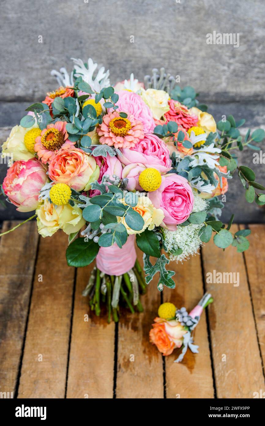 Wedding bouquet with rose, zinnia and brunia flowers. Festive decor Stock Photo