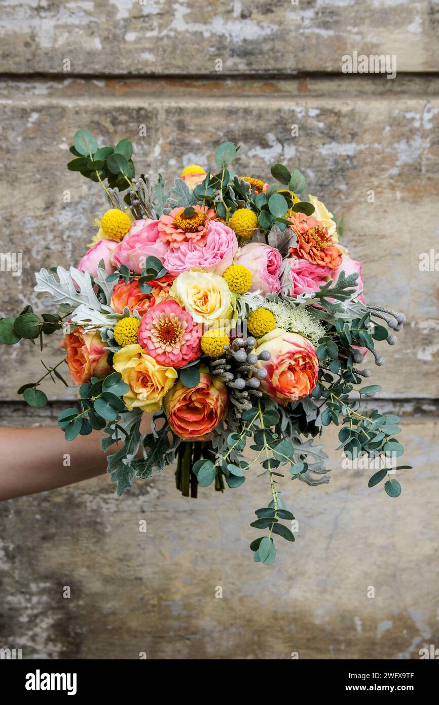 Wedding bouquet with rose, zinnia and brunia flowers. Festive decor Stock Photo
