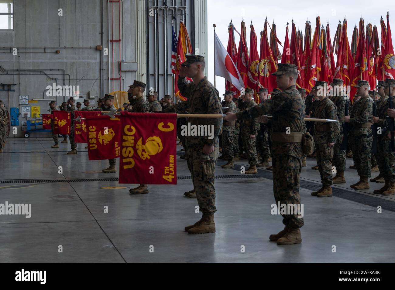 U.S. Marines with III Marine Expeditionary Force stand in formation ...