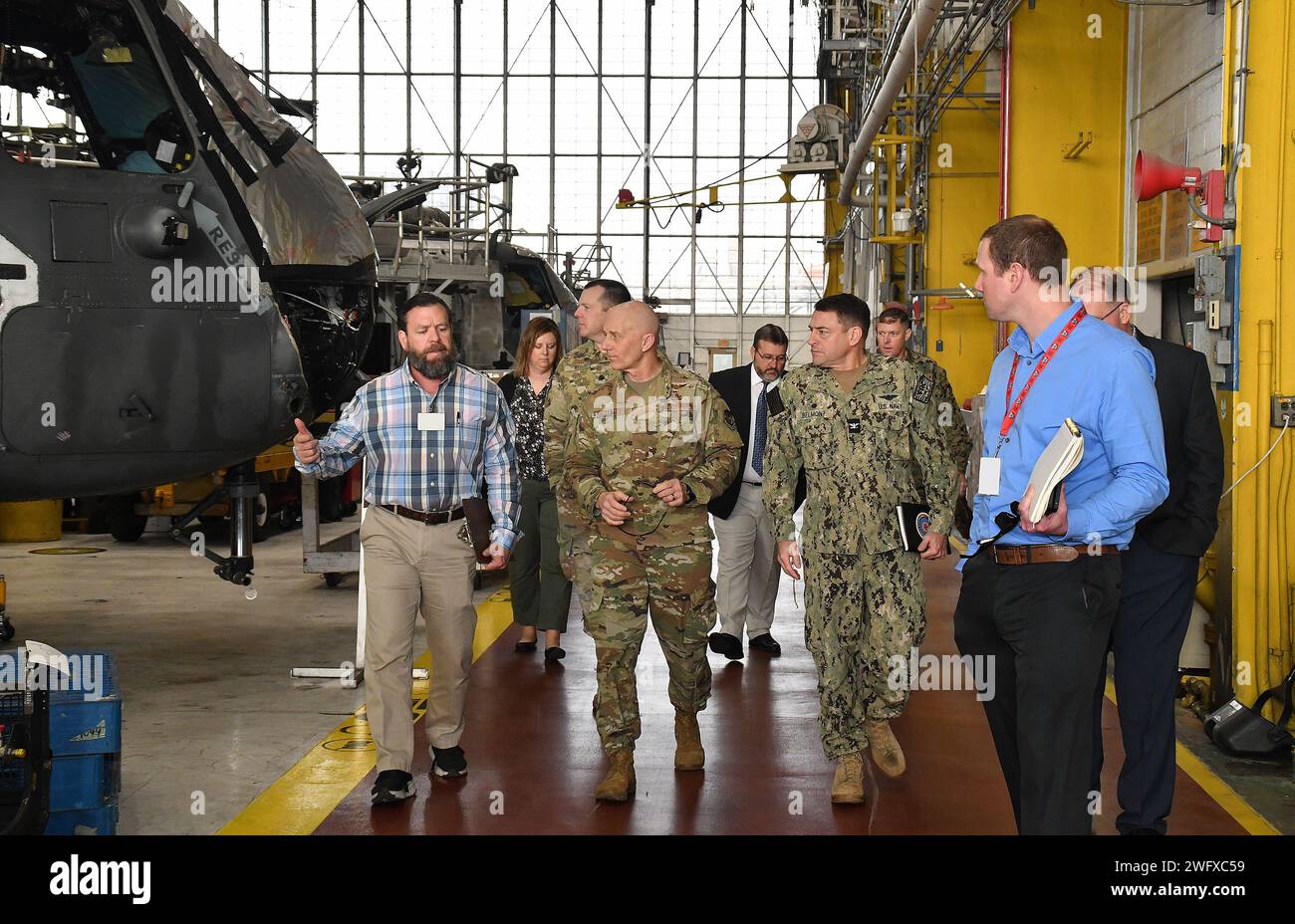 From left, Capability Establishment Program Manager Brian Rayfield of Fleet Readiness Center East (FRCE) discusses the depot’s development of F-35 component repair and overhaul capabilities with Maj. Gen. Donald K. Carpenter, Director of the F-35 Joint Strike Fighter Program Office’s Lightning Sustainment Center; FRCE Commanding Officer Capt. James M. Belmont; and Kyle Gill, F-35 Lightning Support Team depot lead engineer at FRCE. Carpenter visited FRCE Jan. 24 in order to tour the depot’s F-35 components and air vehicle modification lines and familiarize himself with depot operations that sup Stock Photo