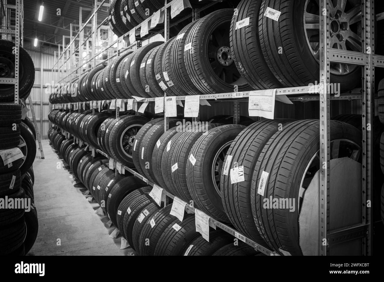 many wheels are stored in the tire warehouse of a car repair shop Stock Photo