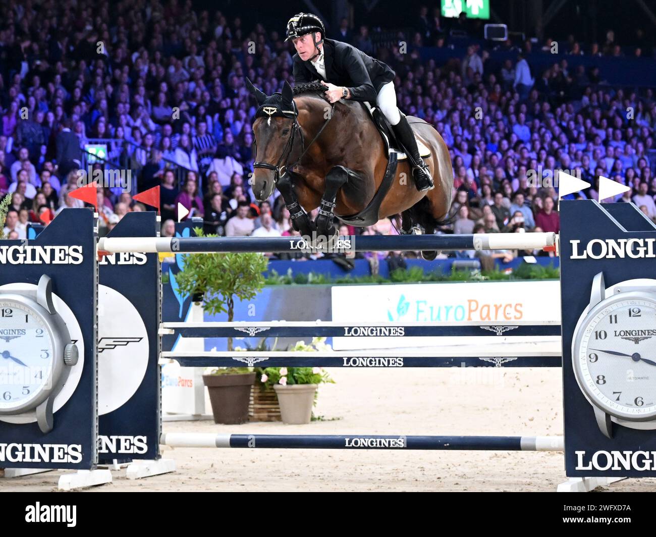 AMSTERDAM - Marcus Ehning with Stargold during the Longines FEI Jumping World Cup at the Jumping Amsterdam 2024 tournament at the RAI on January 28, 2024 in Amsterdam, the Netherlands. ANP | Hollandse Hoogte | GERRIT VAN COLOGNE Stock Photo
