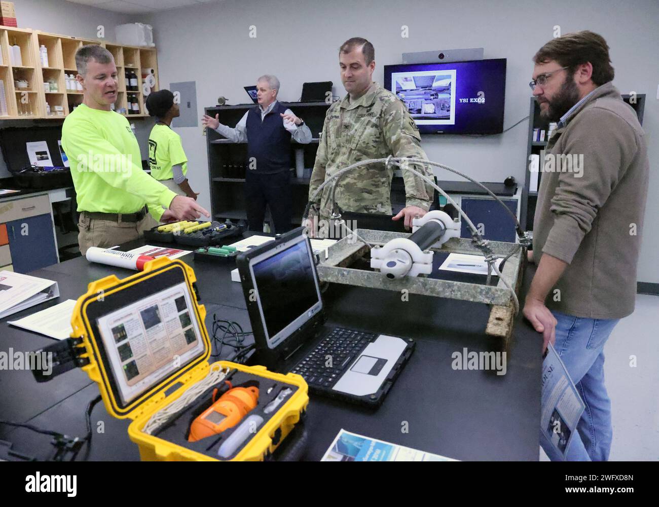 Brad Simmons, U.S. Army Corps of Engineers, Mobile District hydrologic technician, left, describes equipment during an open house at the Data Collection Unit in Irvington, Alabama, Jan. 10, 2024. Simmons described the various equipment the DCU operates to collect data for the District. Stock Photo